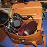 A Canon AE1 SLR, motor drive and accessories, in case