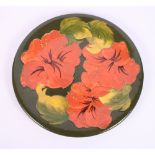 A Moorcroft green ground hibiscus plate, 8" dia