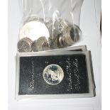 A collection of silver and other World coinage and medallions to include US dollars, proof