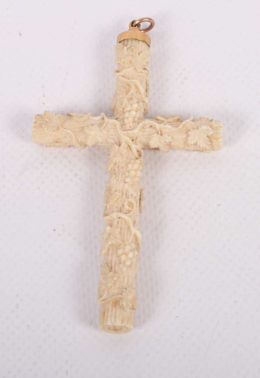 A Dieppe carved ivory crucifix decorated scrolling vines with gold pendant mount