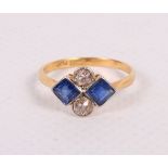 An Art Deco 18ct gold, diamond and sapphire four-stone dress ring, size N/O