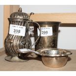 A continental silver beaker with engraved decoration, a continental silver mustard pot and a