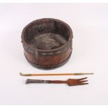 An oriental hardwood and wrought iron bound bowl with ring handle, 10" dia, an opium pipe and a