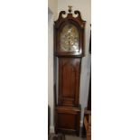 A Georgian oak long case clock with eight-day striking movement, silvered chapter ring, date