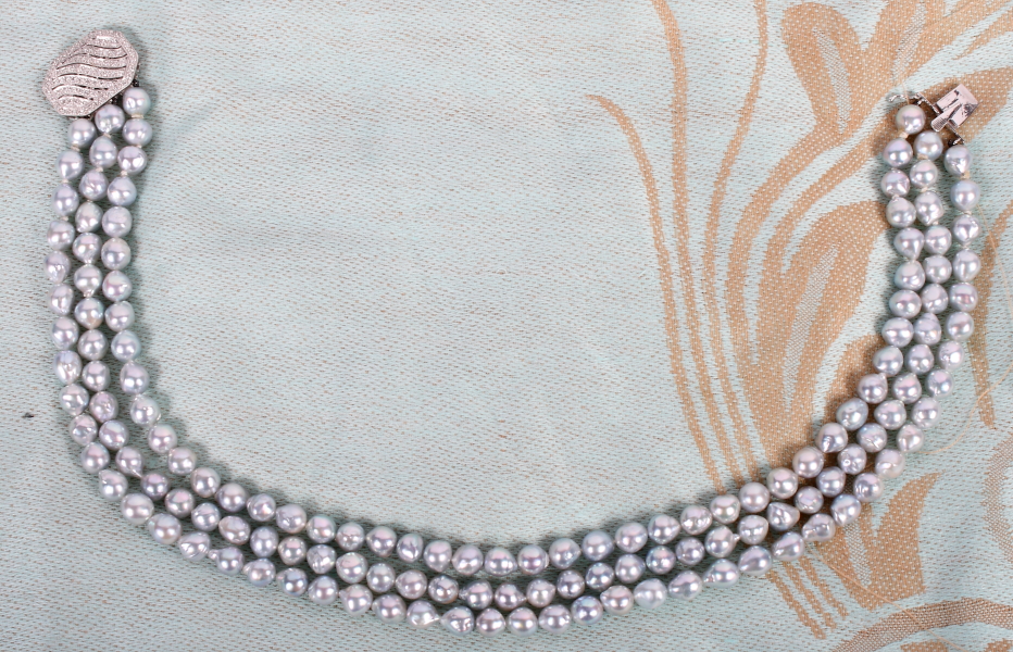 A three-strand cultured pearl choker with 18ct white gold diamond set clasp - Image 2 of 4