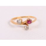 An 18ct gold, diamond and ruby three-stone dress ring, size O