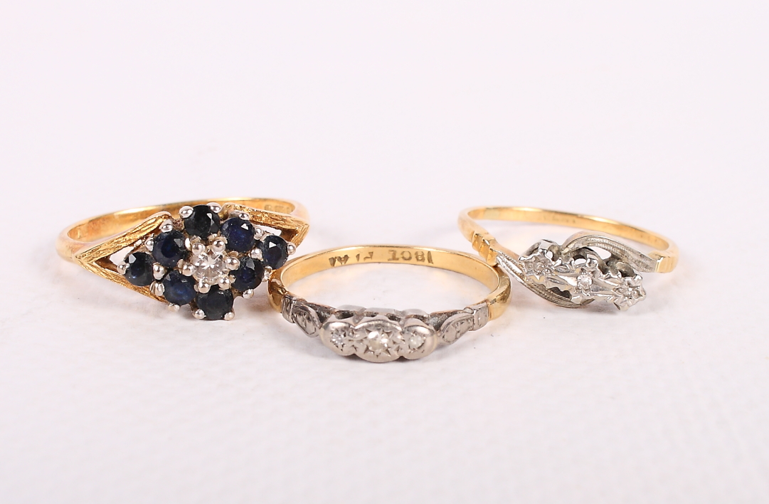 Three 18ct gold gem set dress rings, 8.5g