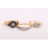 Three 18ct gold gem set dress rings, 8.5g