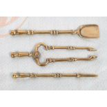 A set of doll's 19th Century miniature brass fire irons