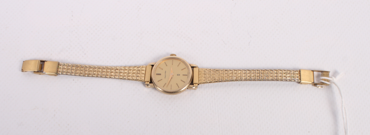 A lady's Mappin & Webb 9ct gold cased manual wind wristwatch with gilt dial and baton numerals, on
