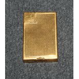 A Dunhill gold plated and engine turned cigarette lighter