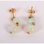 A pair of gold and opal double drop earrings of globular form
