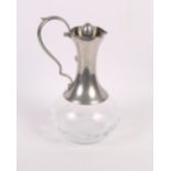 A late 19th Century cut glass sherry decanter, three other decanters and other items of glass