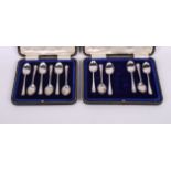 Two sets of six silver rat-tail pattern teaspoons, in cases
