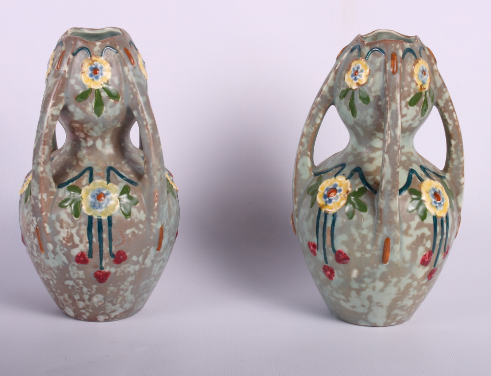 A pair of early 20th Century four-handled enamel decorated vases, 7" high