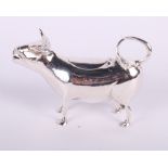 A silver cow creamer, London import marks for 1929, 4 1/4" long, 2.9oz troy approx