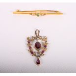 A 9ct gold, peridot and seed pearl bar brooch and a 9ct gold gem set pendant