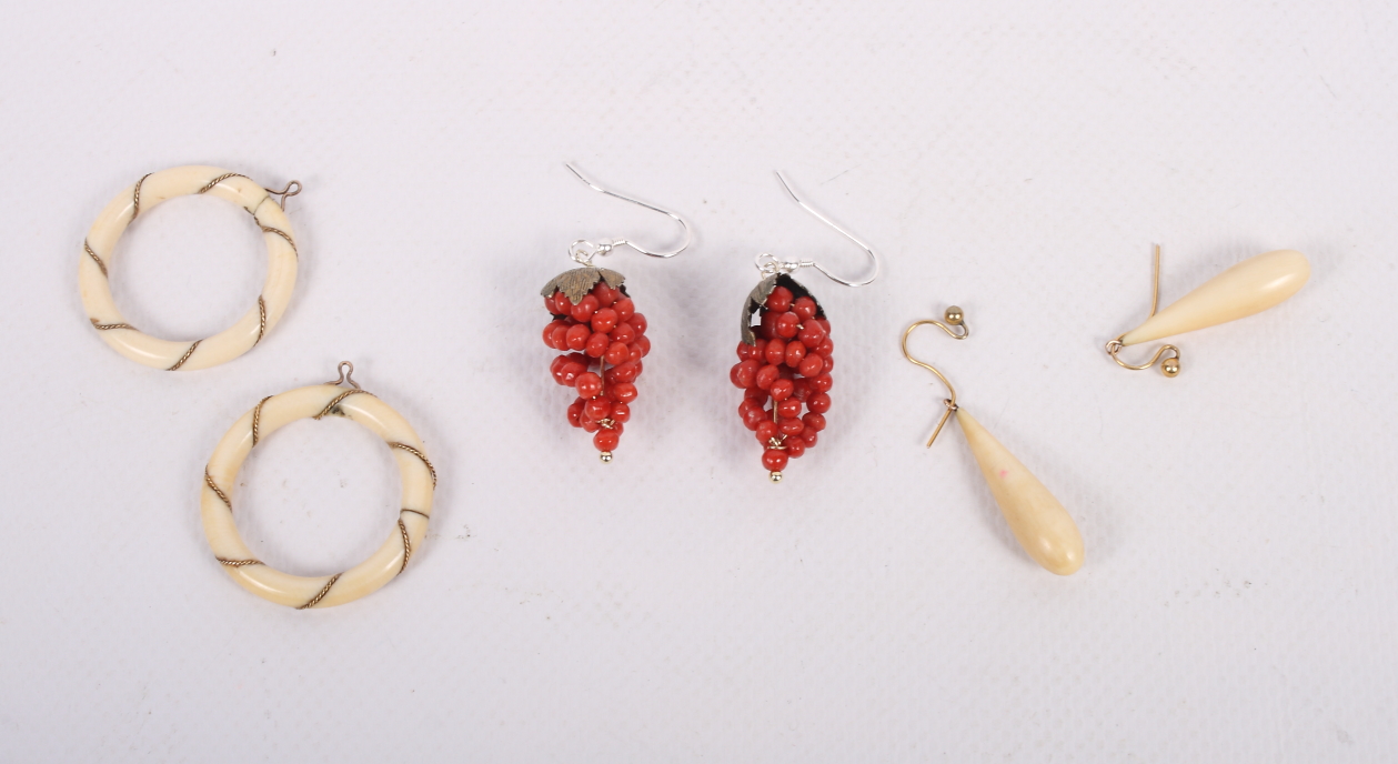 Two pairs of gold and ivory drop earrings and a pair of gilt metal mounted coral earrings formed