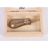 A 19th Century miniature brass powder flask, 3" long