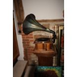 A Perfecta Perophone wind-up gramophone with painted horn, on oak stand