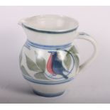 A Laurence McGowan stoneware jug with robin decoration, 8" high, a smaller companion jug, 5 1/2"