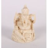 An early 20th Century Indian carved ivory figure of Ganesh, 2 1/4" high