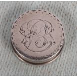 A Georgian white metal circular pill box with engraved decoration