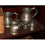 A set of seven pewter measures, in sizes