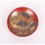 A 19th Century Japanese lacquered miniature dish with stork decoration on a red ground, 3 3/8" dia