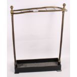 An early 20th Century brass and cast iron umbrella stand