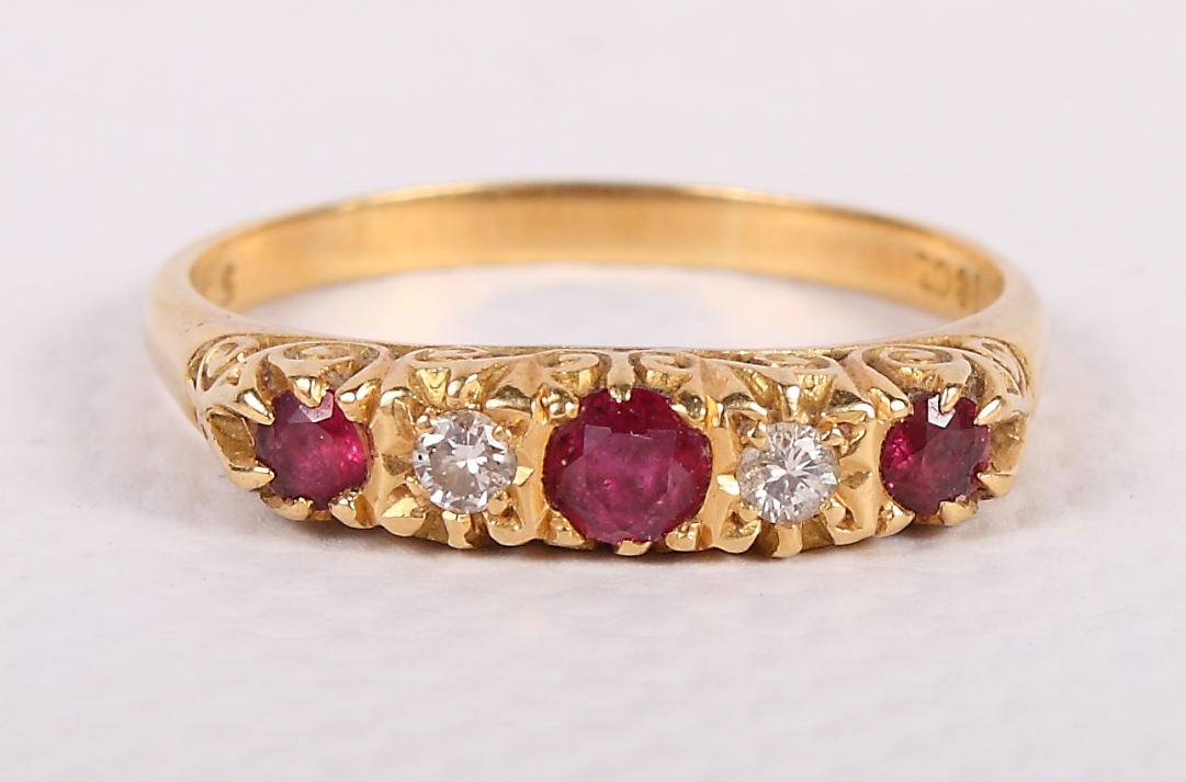 An Edwardian 18ct gold, diamond and ruby five-stone dress ring, size T, 3.8g
