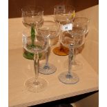 A set of six German cut hock glasses with coloured stems