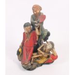 A Chinese carved and painted hardstone figure group, three sages, 6" high