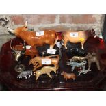 A Beswick bull, "Ch Dunsley Coy Boy" (horns restored), a ceramic Highland cow and a number of