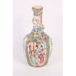 A pair of Canton enamel vases with figure decoration and dragons, 7" high, a larger similar vase,