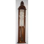 An Admiral Fitzroy barometer in walnut case