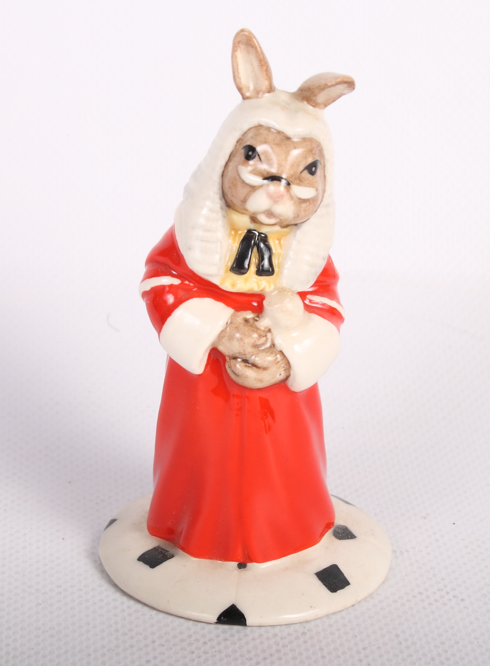 A Royal Doulton china model of a seated white kitten, a "Judge Bunnykins" figure, a Doulton Images