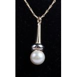 A pair of 9ct gold cultured pearl mounted earrings and a similar pendant on chain