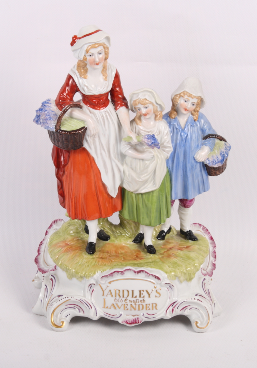 A Dresden porcelain "Yardley's Old English Lavender" figure group, 12" high