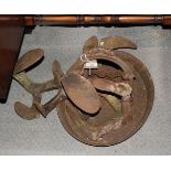 A cast iron boot scraper and four cobbler's lasts