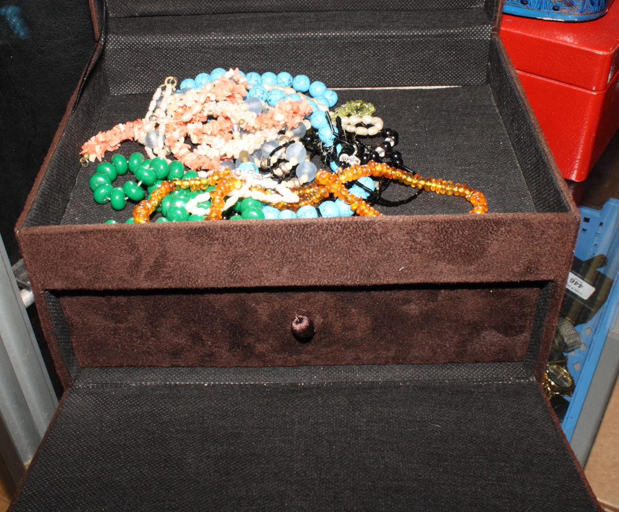 Three boxes of costume jewellery and watches to include an amber bead necklace, 53.6g