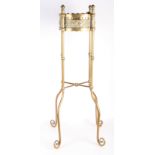 A Victorian Gothic style brass plant stand