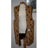 A 1970s brown diamond pattern fur gilet