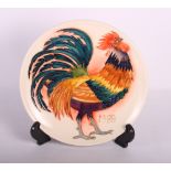 A Moorcroft limited edition 1988 Christmas plate decorated a cockerel, 27/250, 9" dia