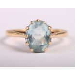 A 9ct gold and aquamarine single stone dress ring, size Q/R, and a 9ct gold mounted aquamarine