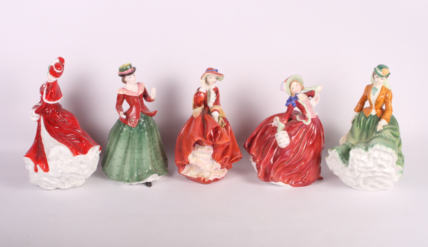 Five Royal Doulton china figures, "Autumn Breezes" HN1934, "Top o' the Hill" HN1834, "Nicole"