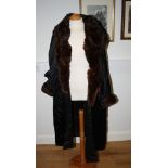 A 1930s satin and fur trimmed evening coat