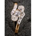 An 19ct gold and platinum set three stone ring