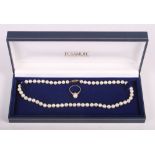 A 14k ring set pearl and a pearl necklace with 9ct gold clasp