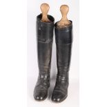 A pair of gentleman's black leather hunting top boots with boot stretchers, size 11 approx